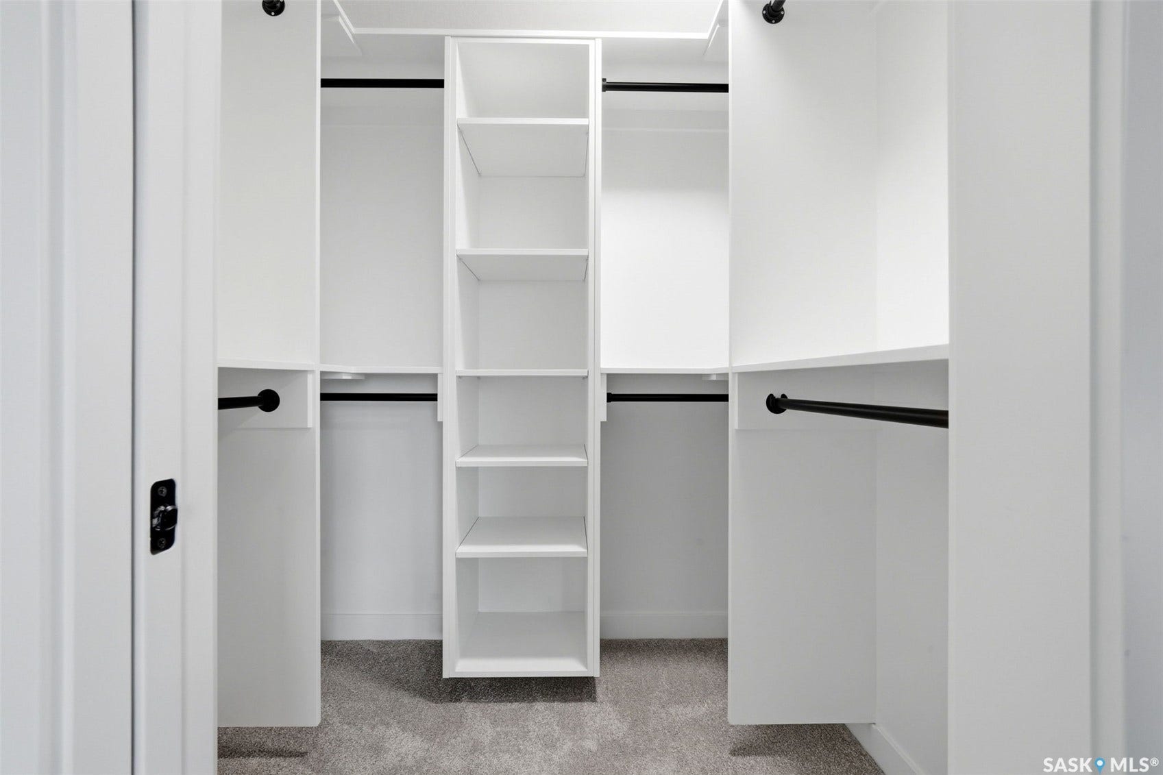 White built-in closet shelving system with multiple storage racks and integrated hanging rods