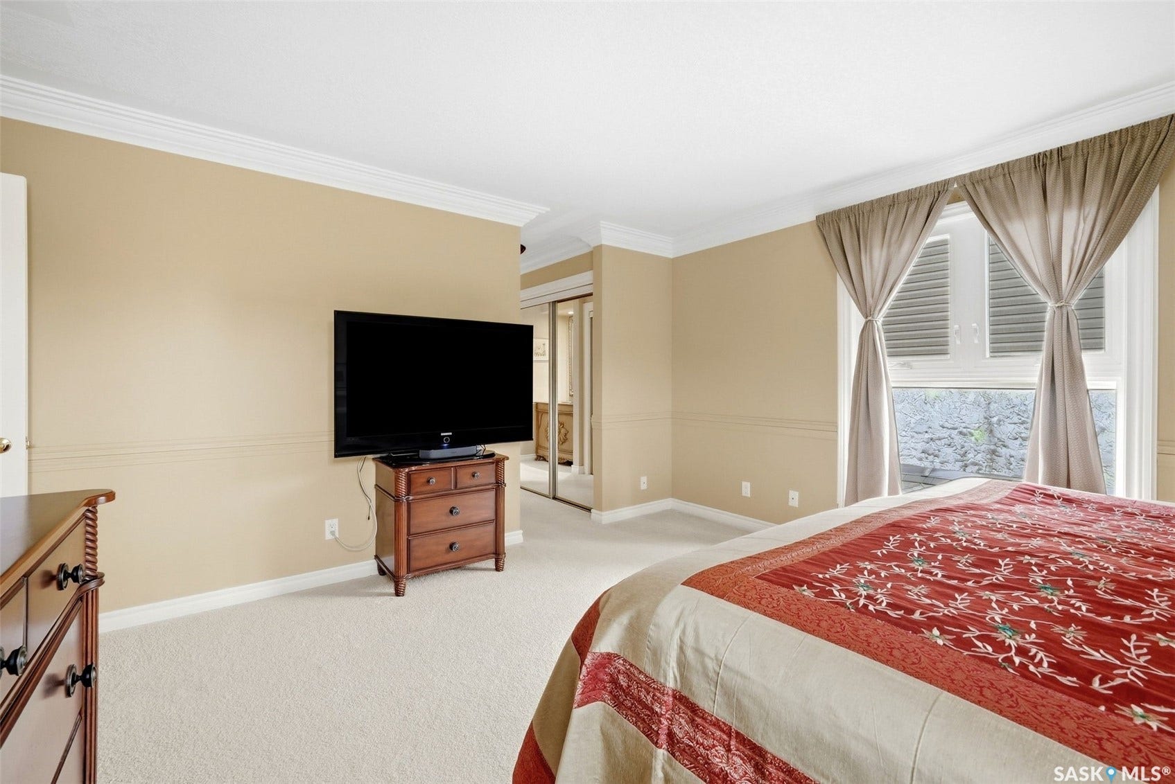 Neutral-toned walls with chair rail molding