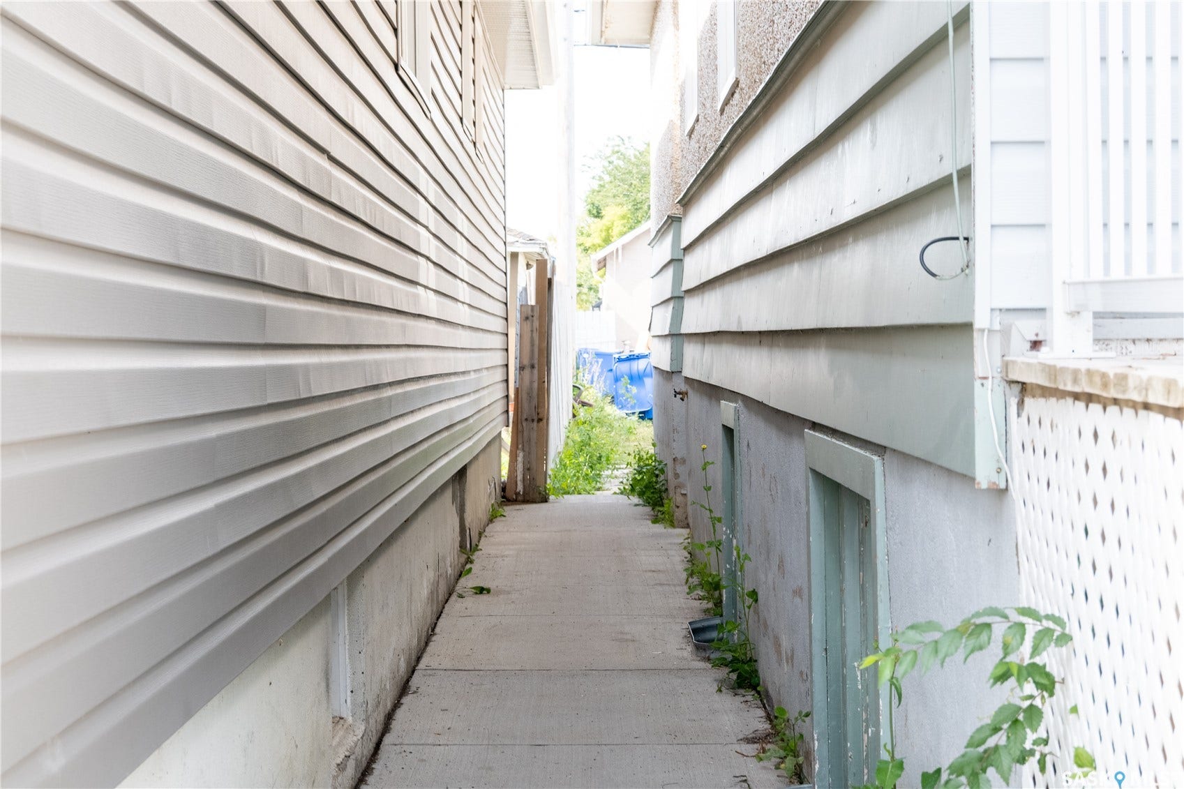 2232 McAra Street, Regina SK S4N 2W1 Concrete walkway between two structures