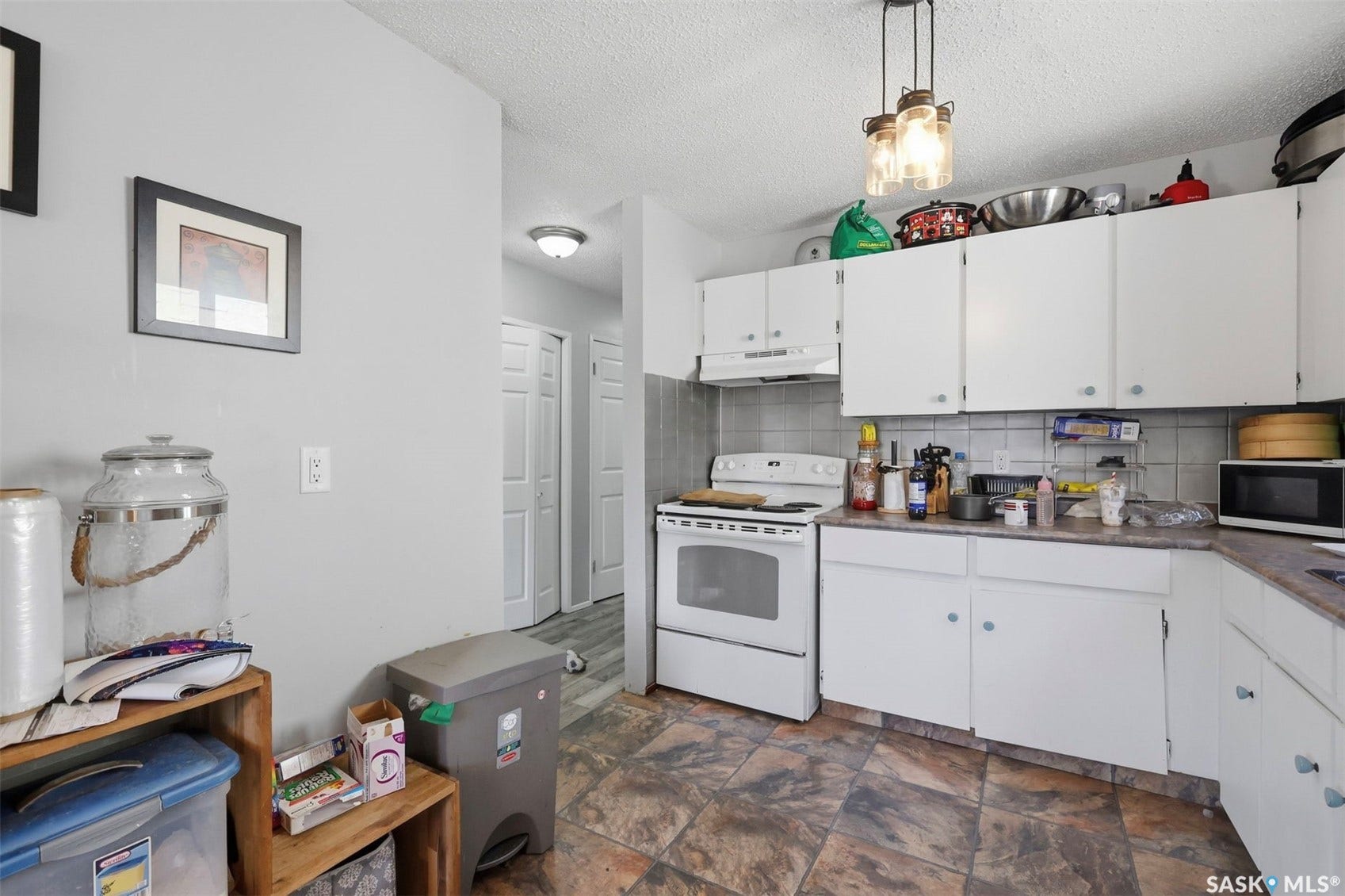 White cabinetry with integrated range hood