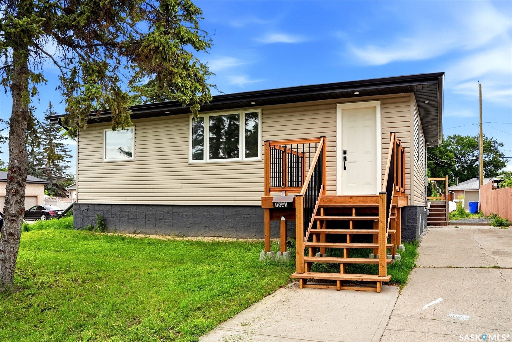 1601 Lacon Street, Regina SK S4N 1Z5 Tan horizontal siding exterior with a dark foundation