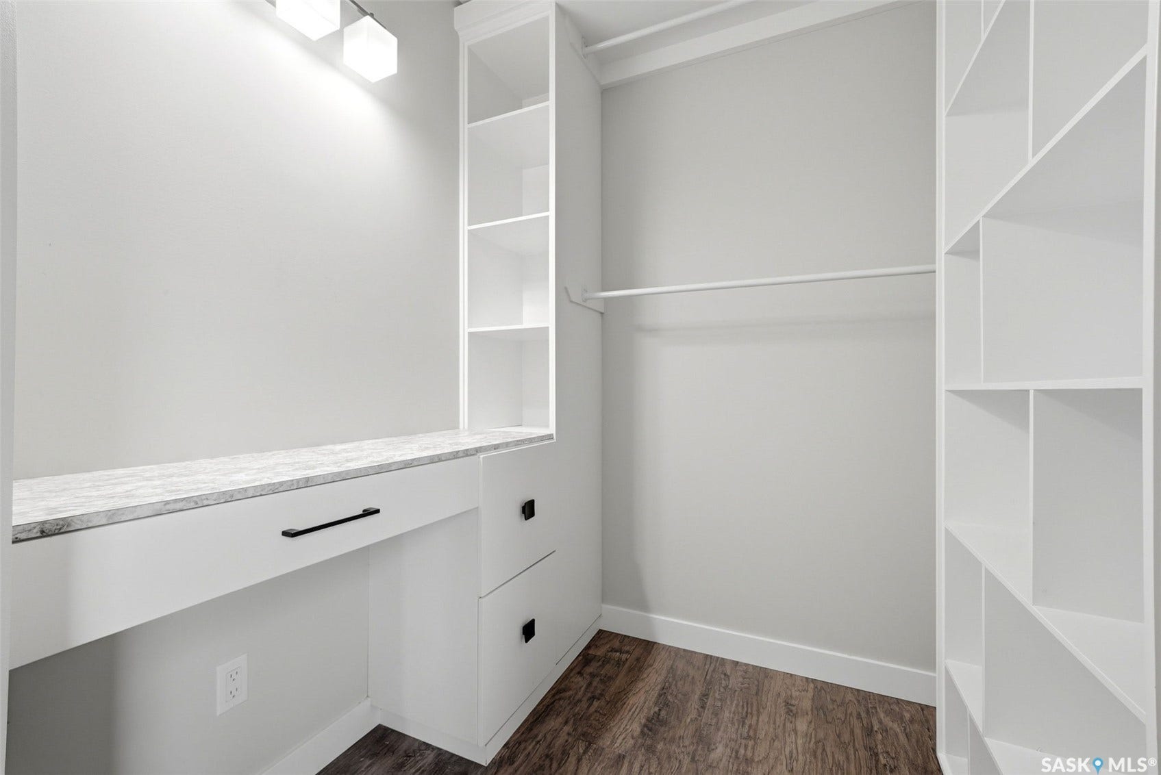 1601 Lacon Street, Regina SK S4N 1Z5 Built-in shelving, wood-finish flooring, built-in dresser with a stone-look countertop, and recessed lighting