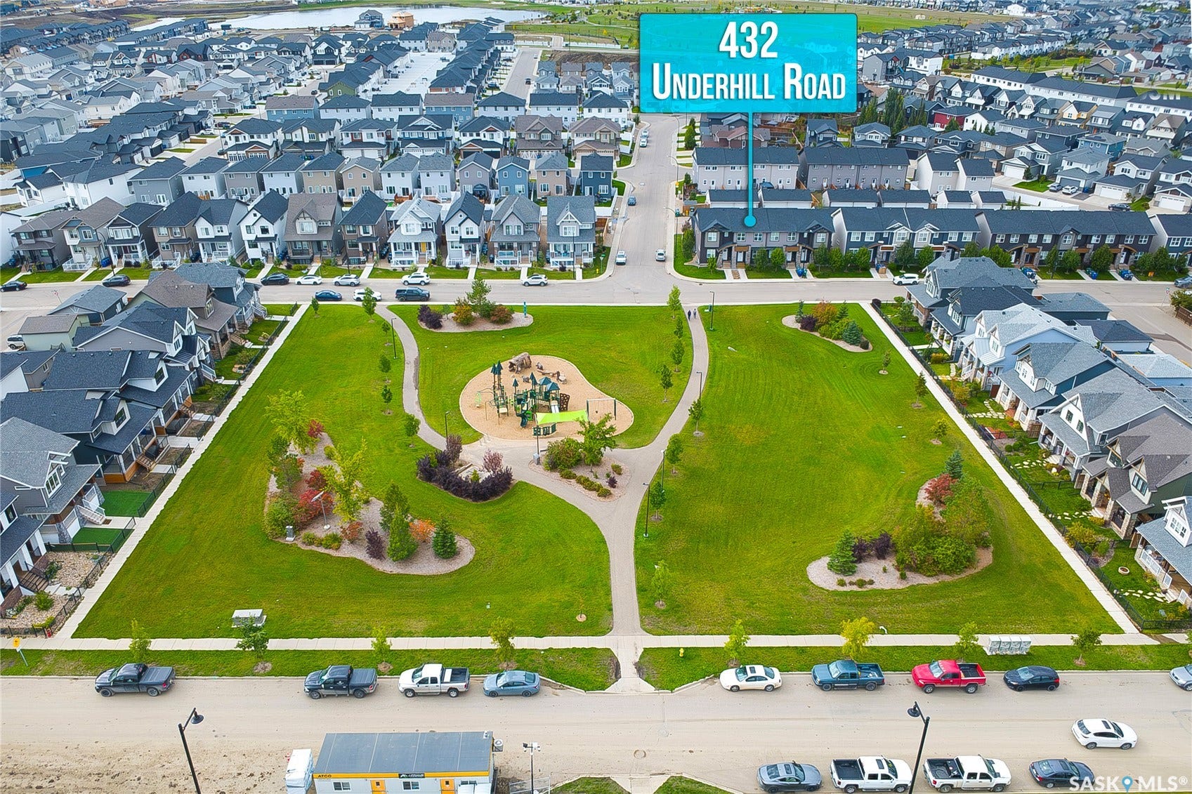 Expansive community park with green spaces and recreational equipment