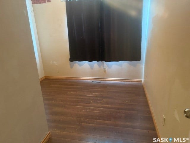 Wood-finish flooring with light-toned wall finishes