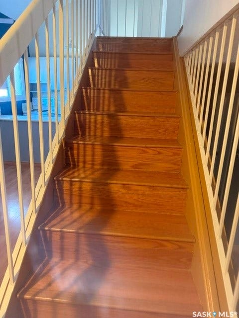 Hardwood staircase with painted balusters