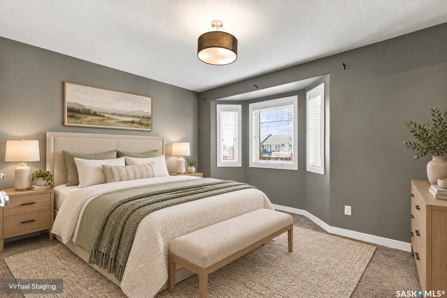 Tray ceiling with recessed lighting, bay window, and neutral wall tones