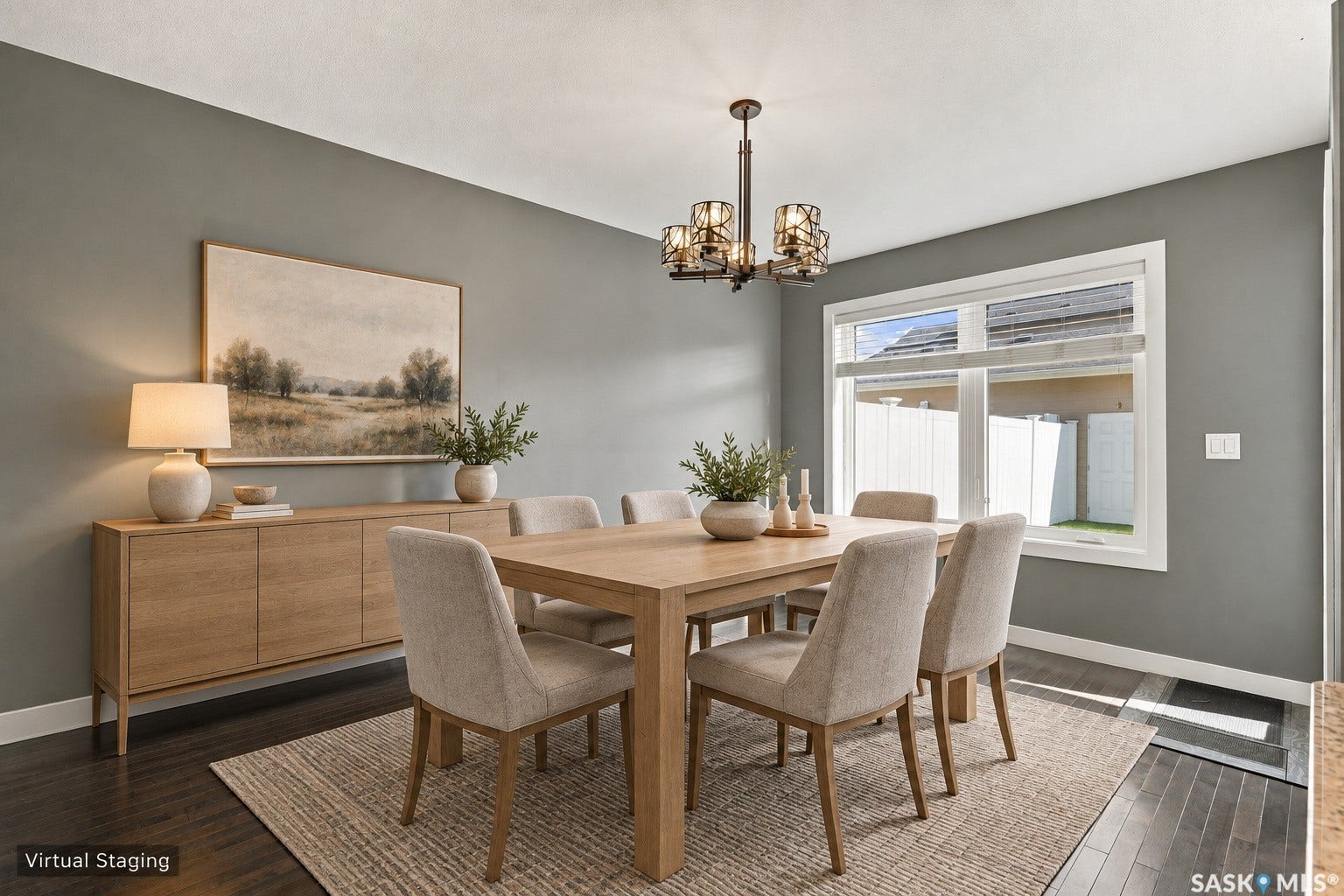 Dark wood-finish flooring, a contemporary chandelier, and a large window with white trim