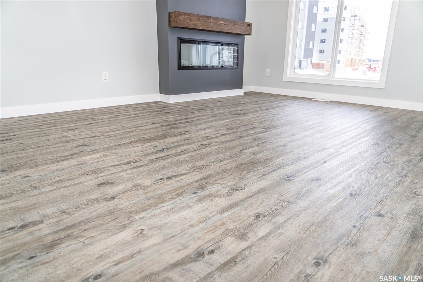 306 Stehwien Street, Saskatoon SK S7W 1P3 FIREPLACE IS OPTIONAL UPGRADE. wood-style floors and lofted ceilingPRICE