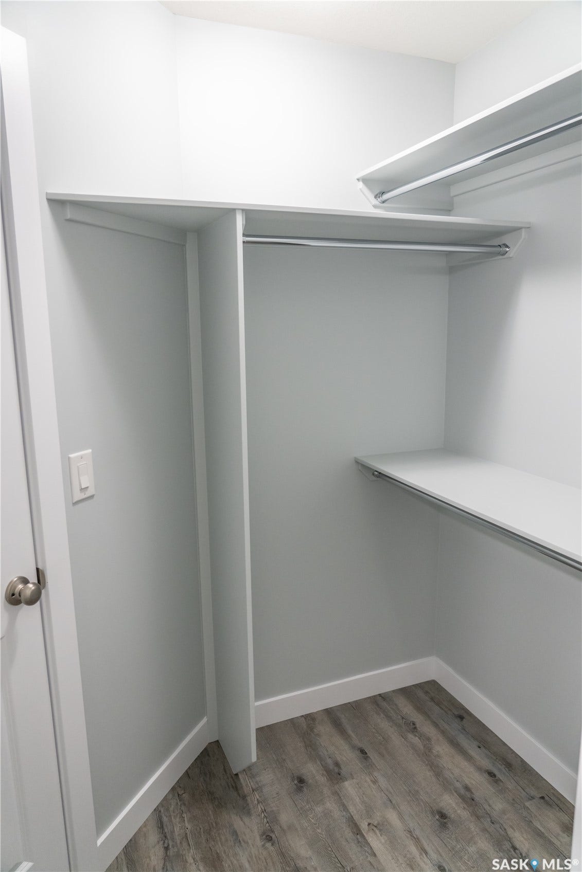 306 Stehwien Street, Saskatoon SK S7W 1P3 Spacious closet with dark wood-type flooring