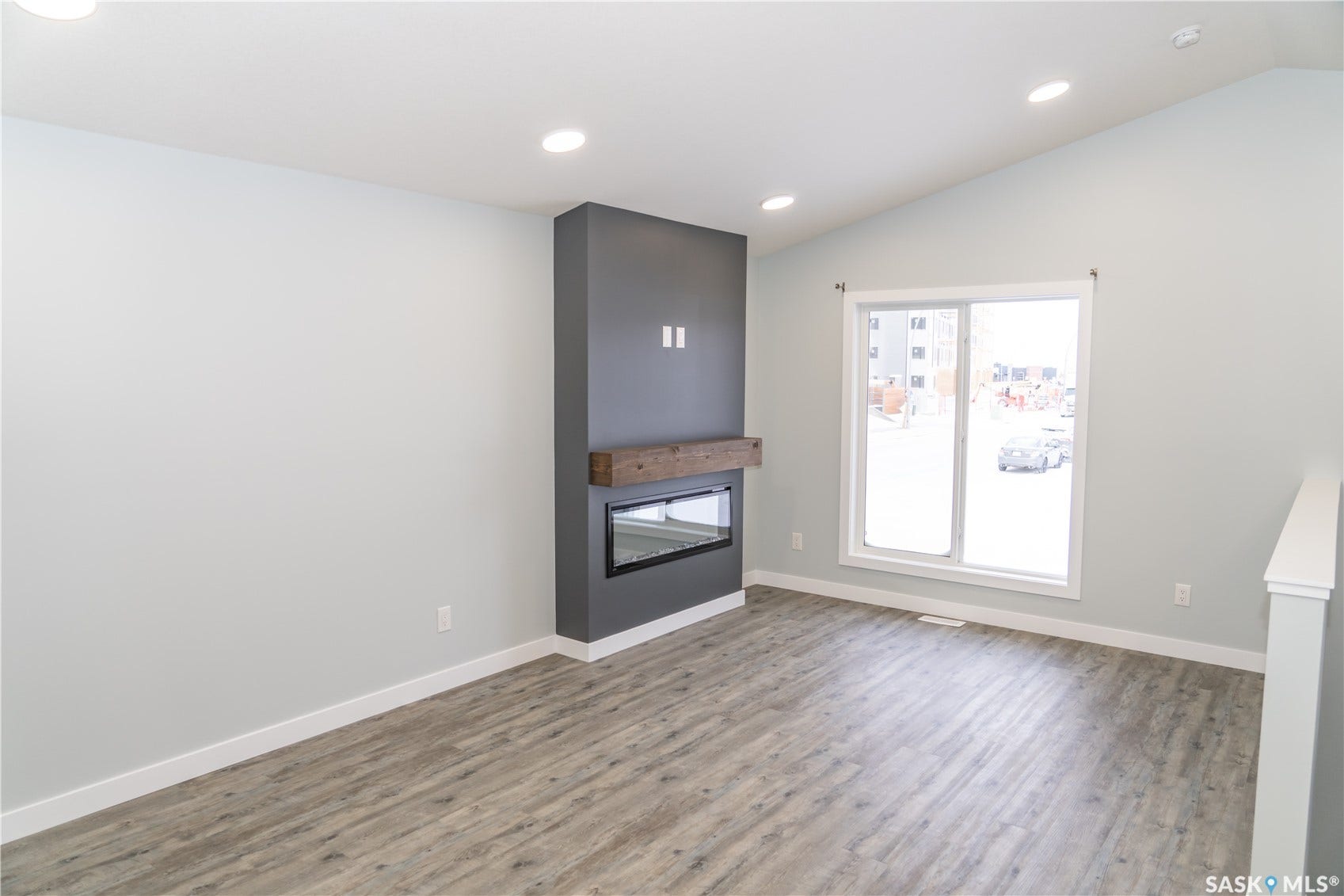 306 Stehwien Street, Saskatoon SK S7W 1P3 FIREPLACE IS OPTIONAL UPGRADE. wood-style floors and lofted ceiling