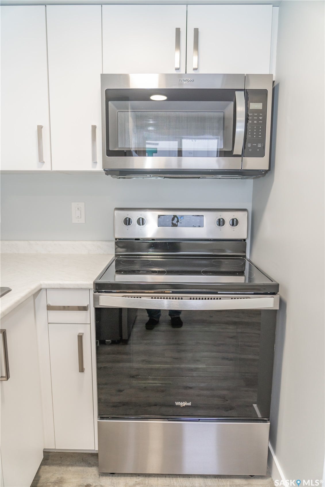 306 Stehwien Street, Saskatoon SK S7W 1P3 Kitchen featuring appliances and white cabinets