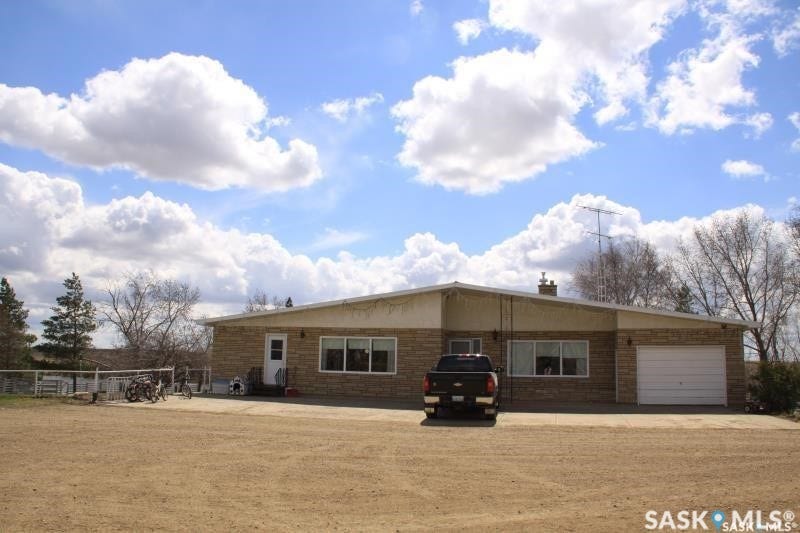 Brick exterior with a single-car garage and a white garage door