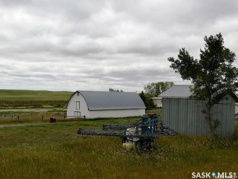 White barn with arched roofline