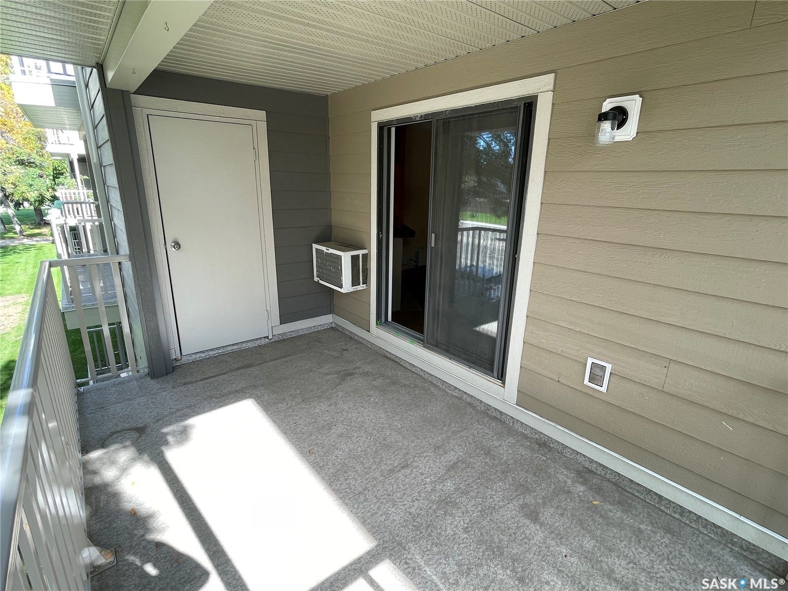 Private balcony 14feet X 12 feet featuring a dura deck surface, sliding glass door entry, exterior storage closet, and perimeter railing