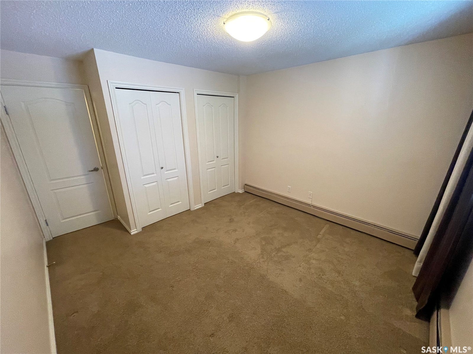 Wall-to-wall carpeting, two bi-fold closet doors.