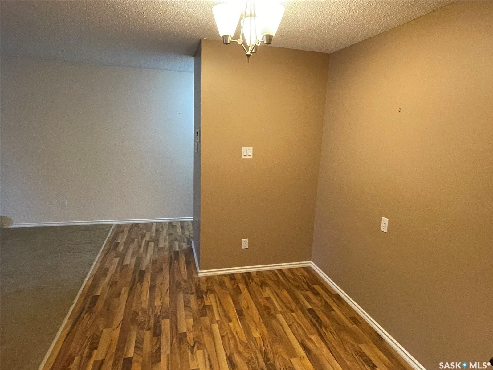 Wood-finish flooring with baseboard trim