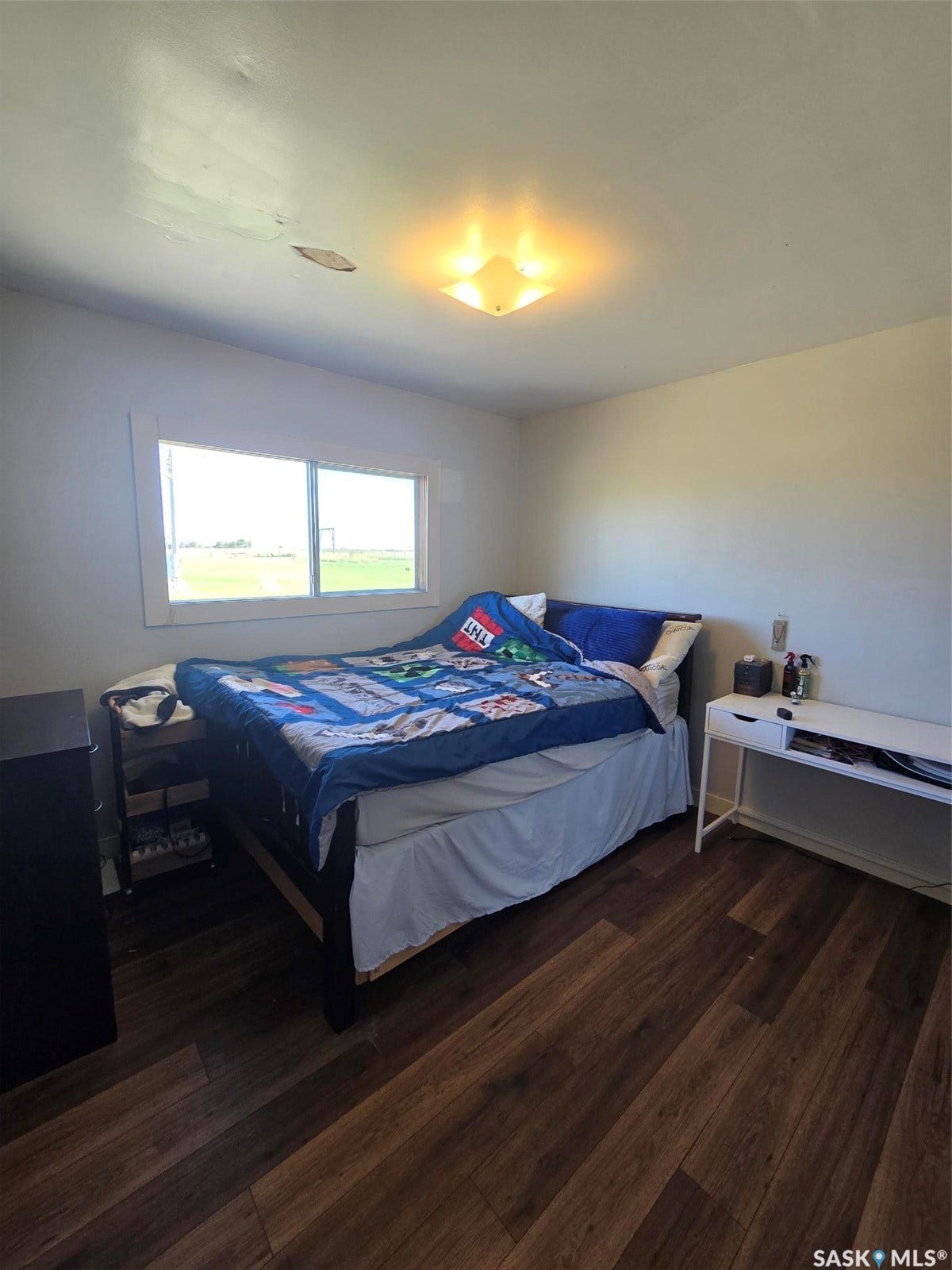 3RD BEDROOM -Hardwood flooring and a window with natural light