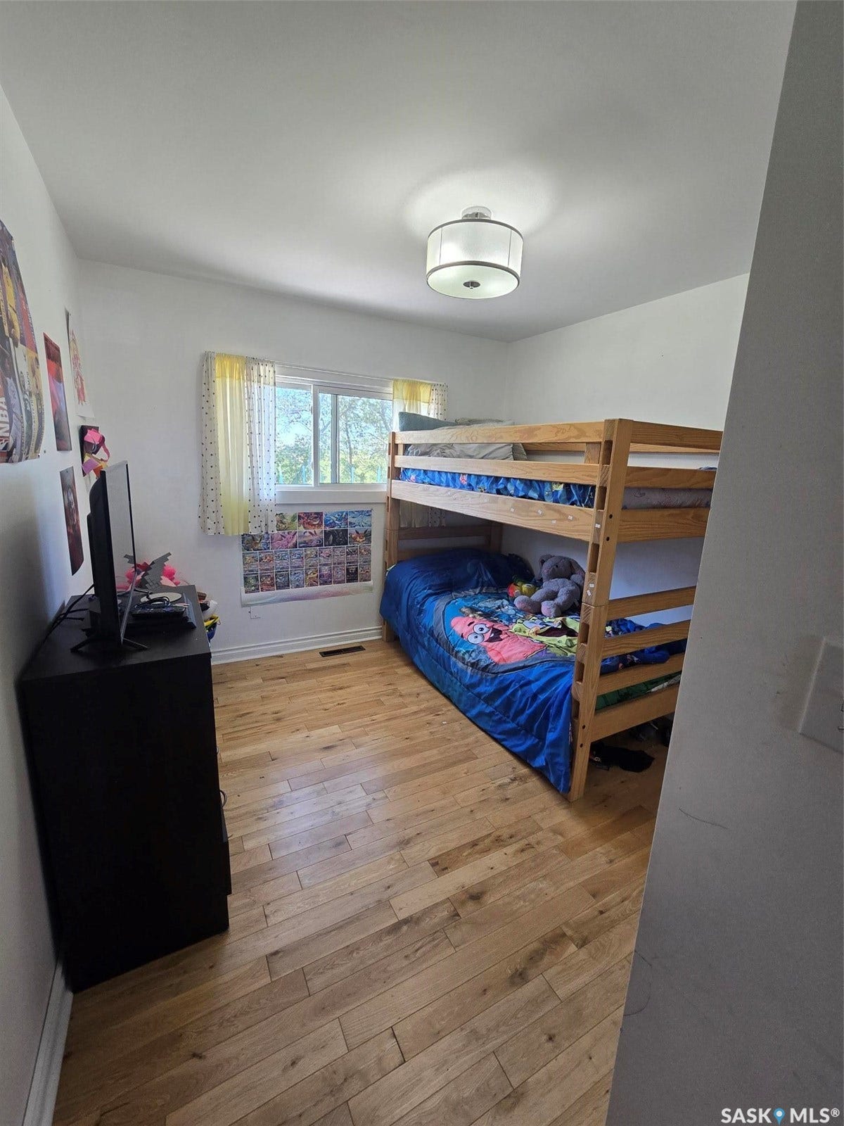 3RD BEDROOM -Hardwood flooring and a window with natural light