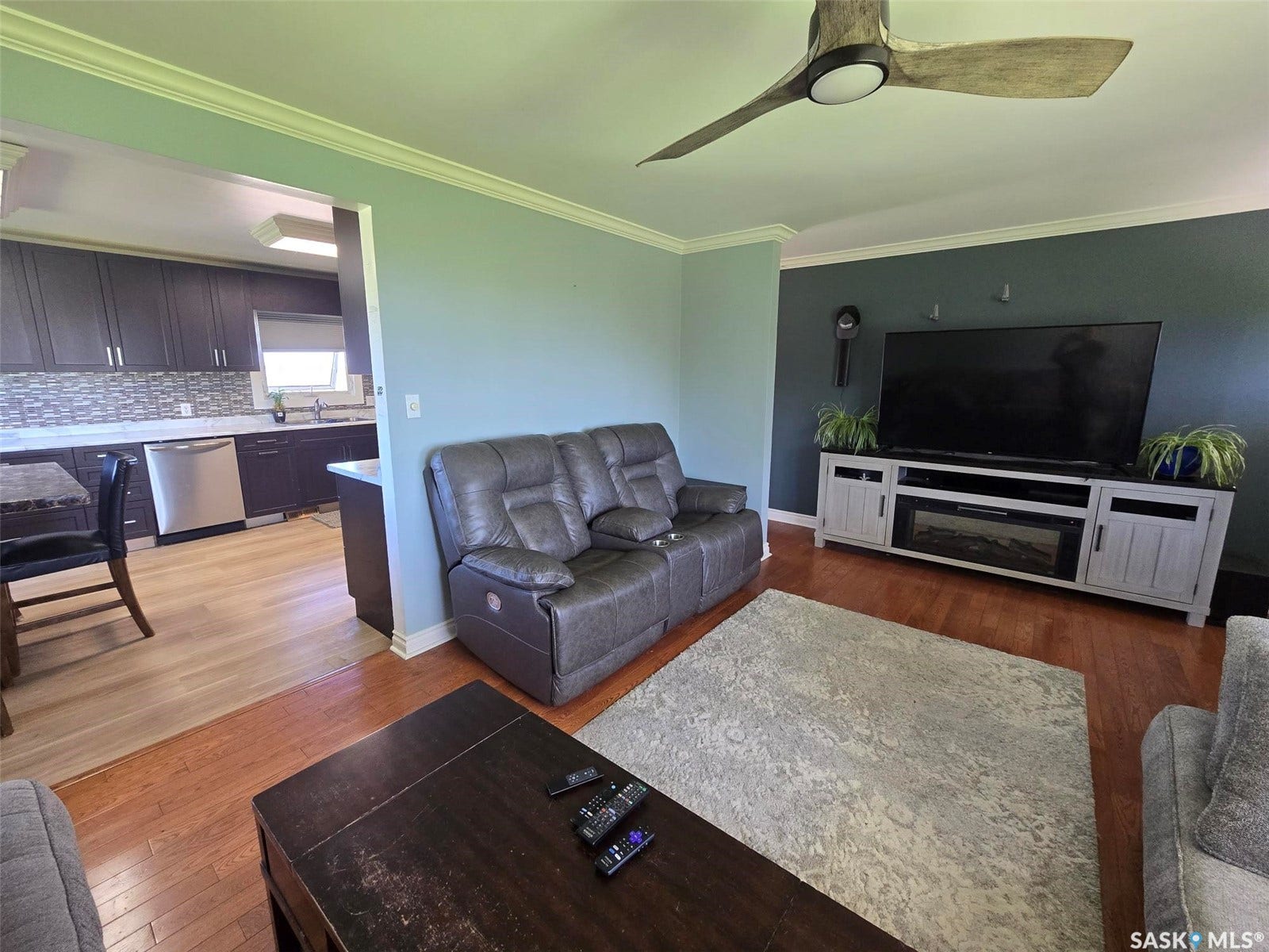 Wood-finish flooring throughout, with crown molding detailing