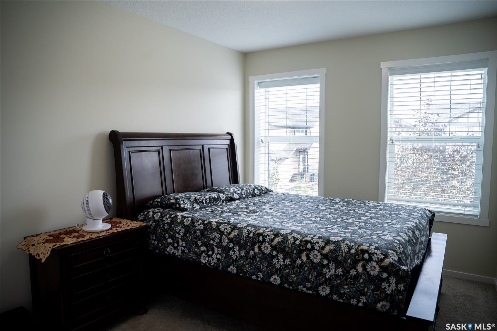 Two double-hung windows with white blinds