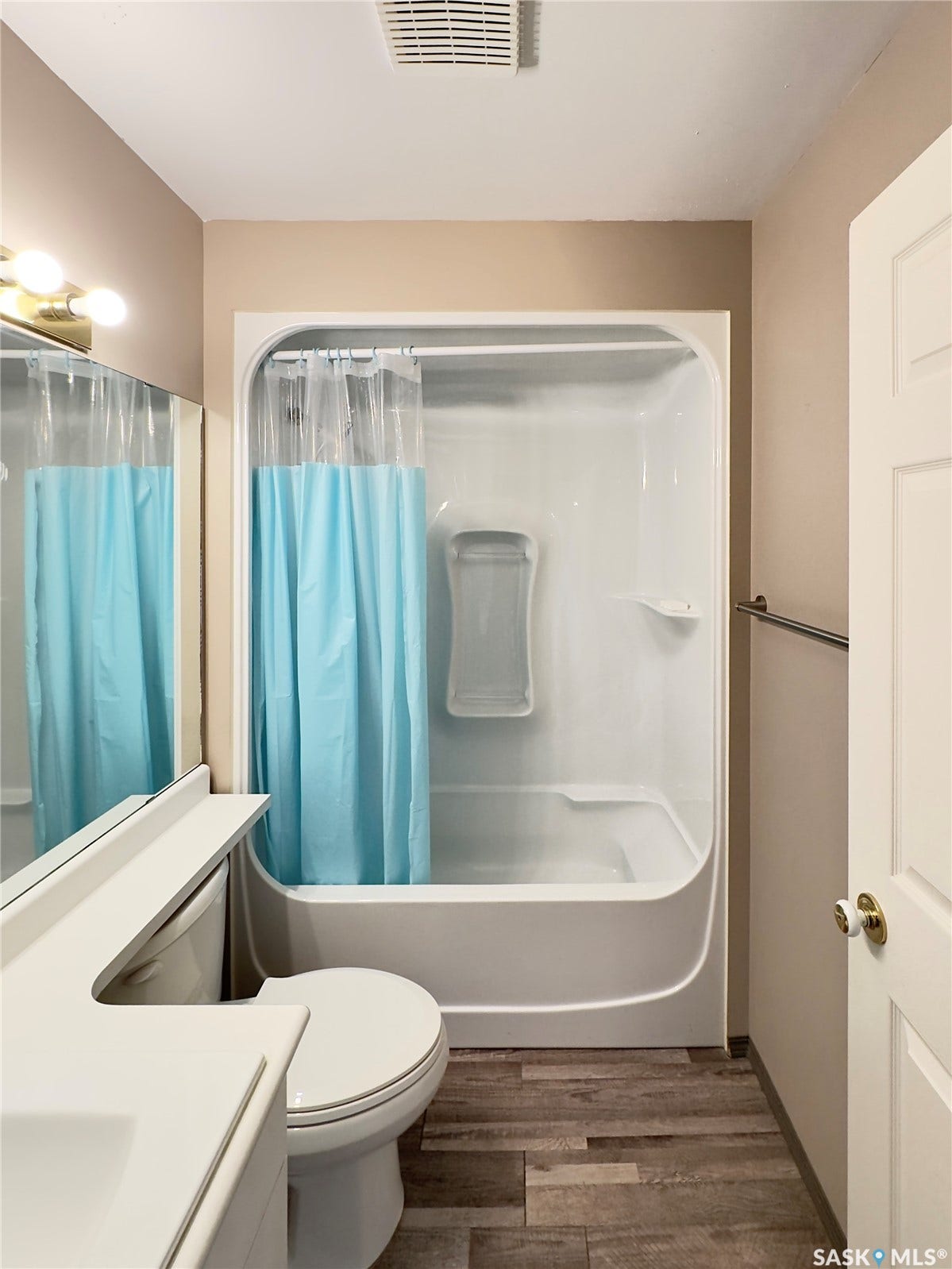 Tub and shower combination with a single-handle faucet
