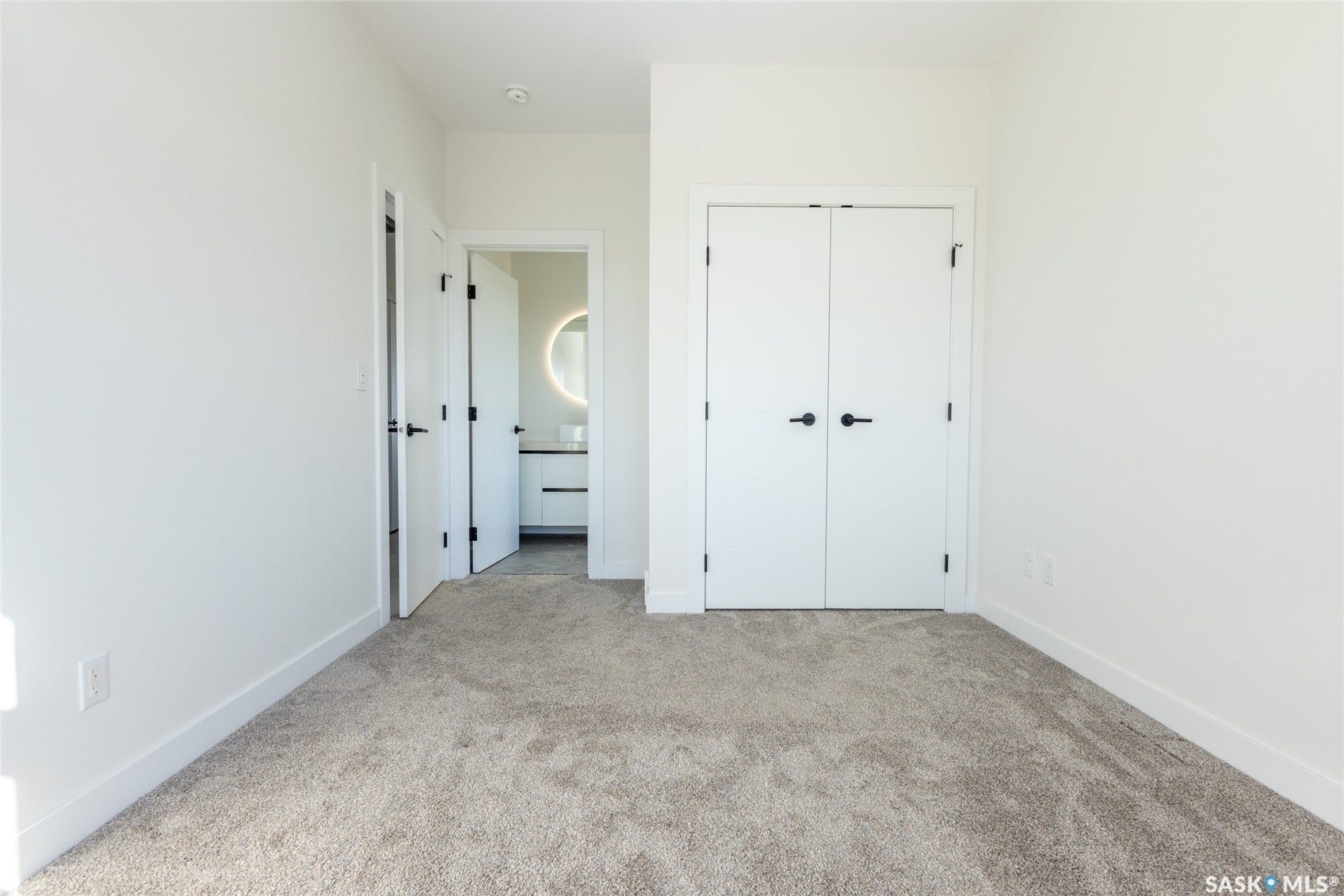 Plush carpet flooring complements crisp white walls