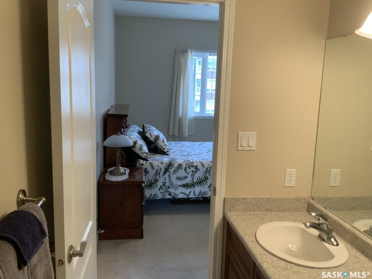 Bathroom vanity with an integrated sink and chrome faucet