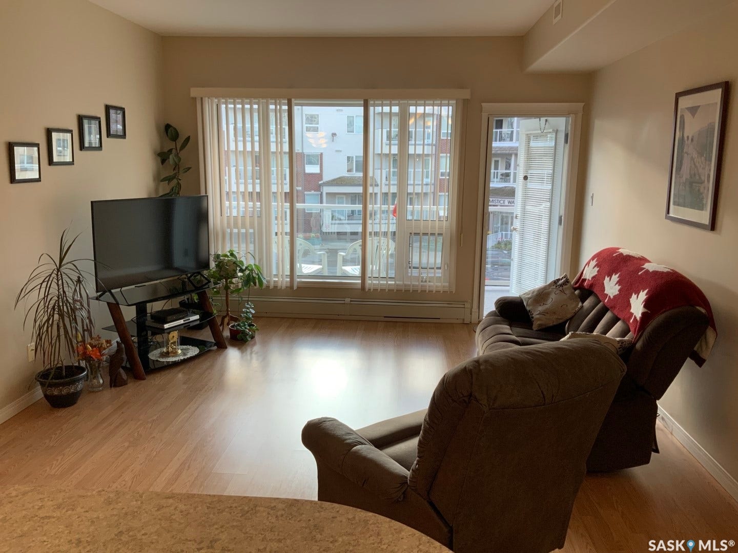 Wood-finish flooring throughout, sliding glass patio door, and additional outdoor access