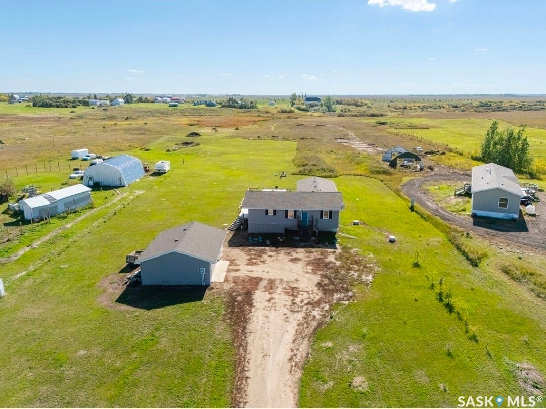 Expansive property featuring a main residence, a detached garage.