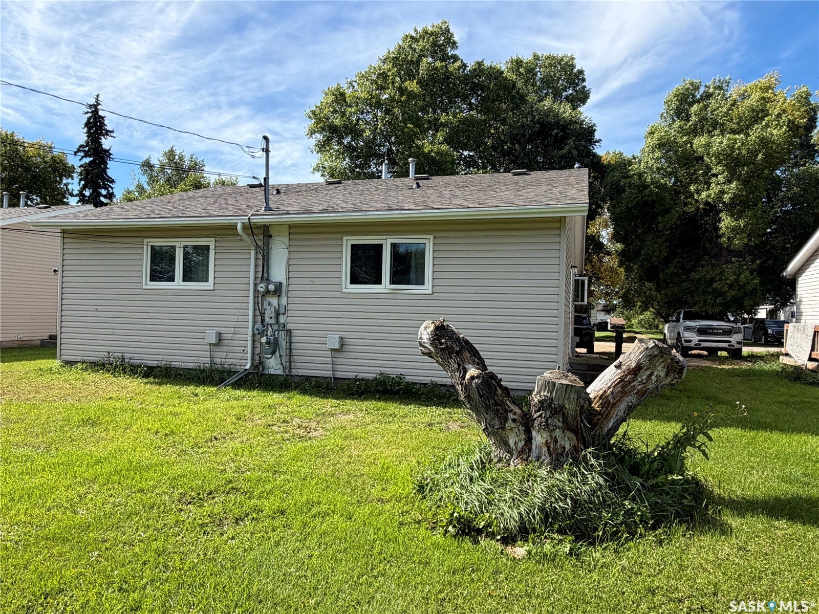 Side exterior with horizontal siding and multiple windows