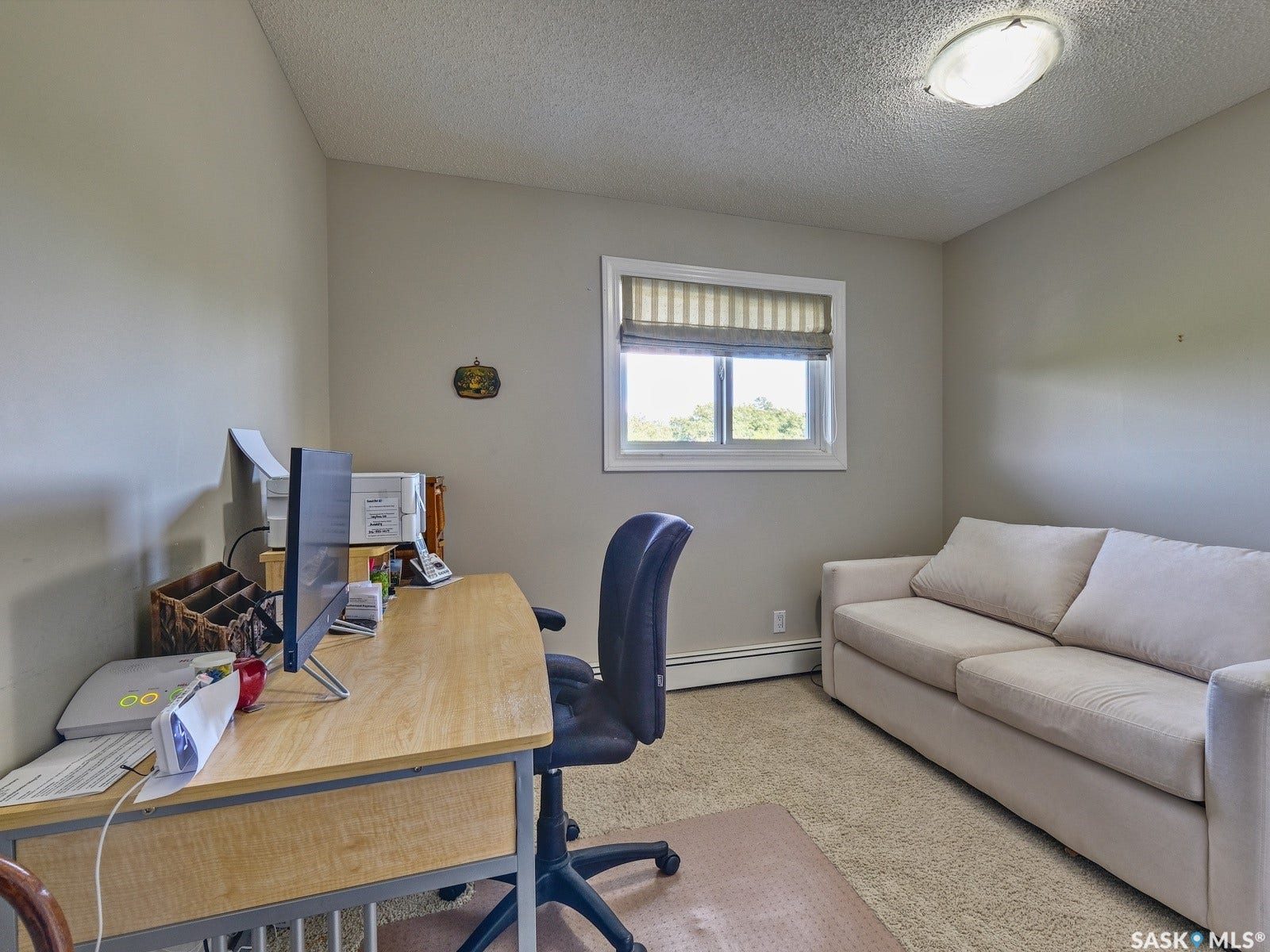 305 1st Street W, #302, Rosetown SK S0L 2V0 Neutral wall paint, ceiling-mounted light fixture, and a window with blinds