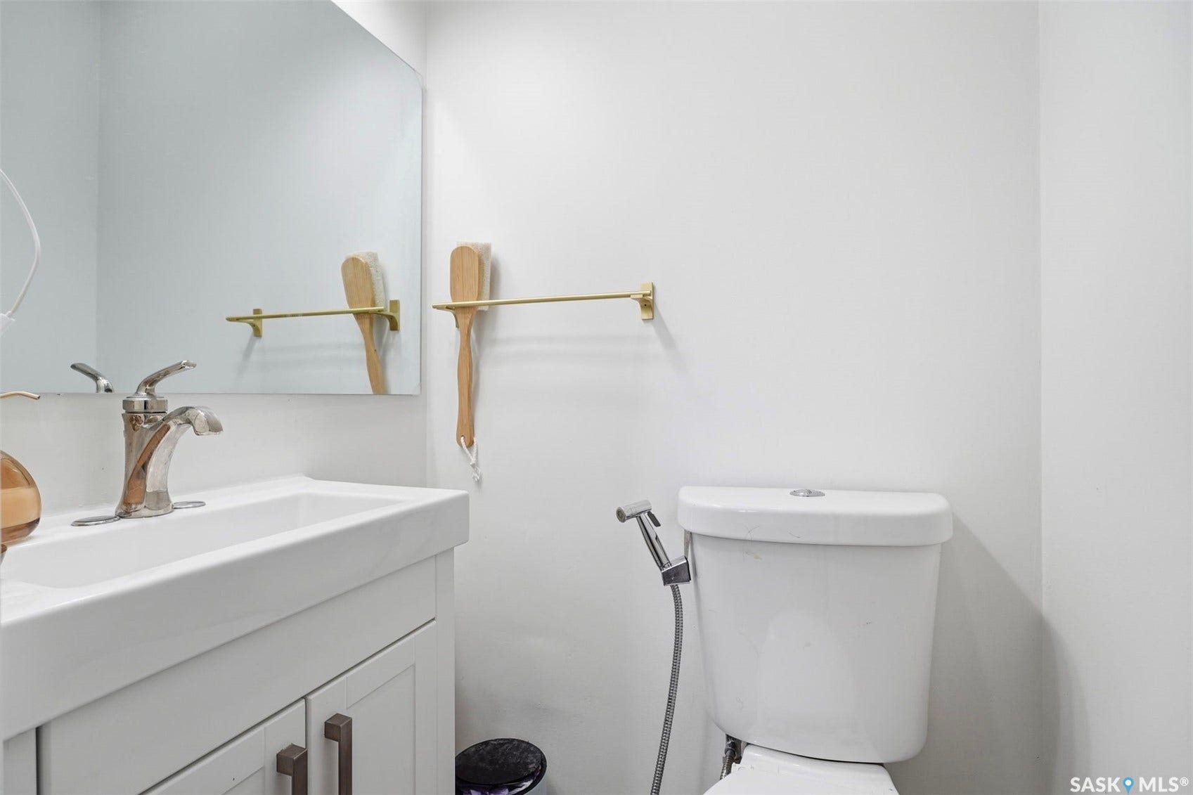 White vanity with rectangular integrated sink and chrome faucet