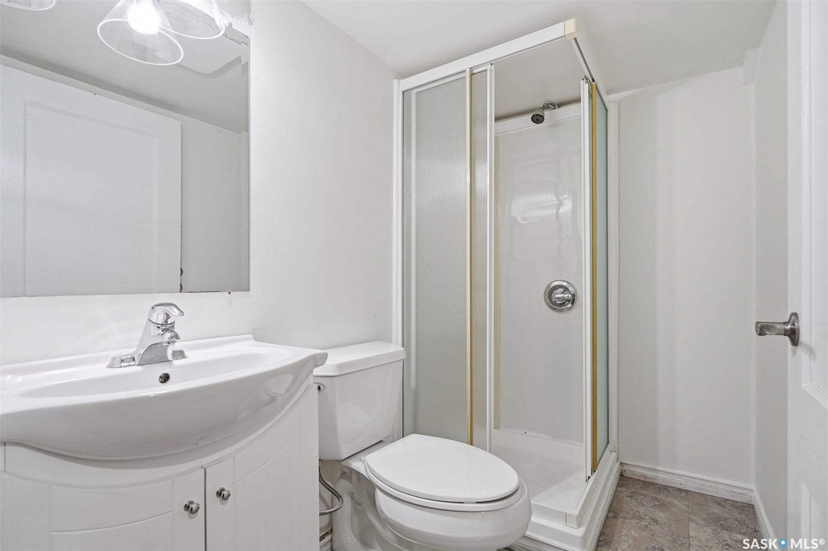White vanity with integrated sink and chrome faucet