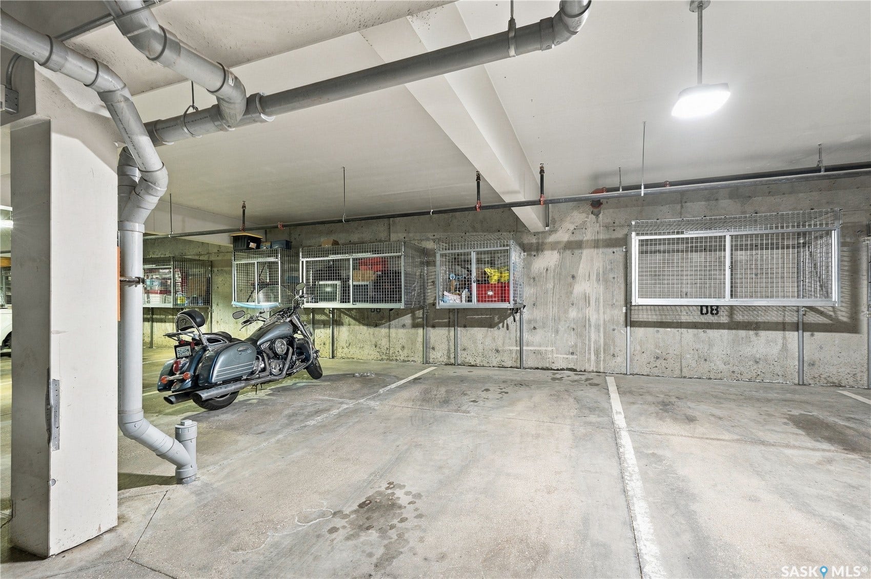 Concrete parking surface with painted parking space delineation