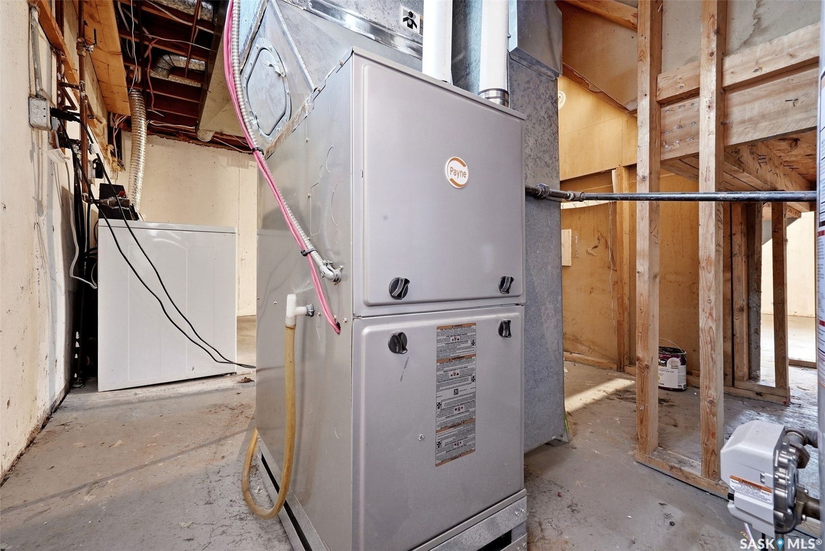 Utility area featuring a furnace and water heater