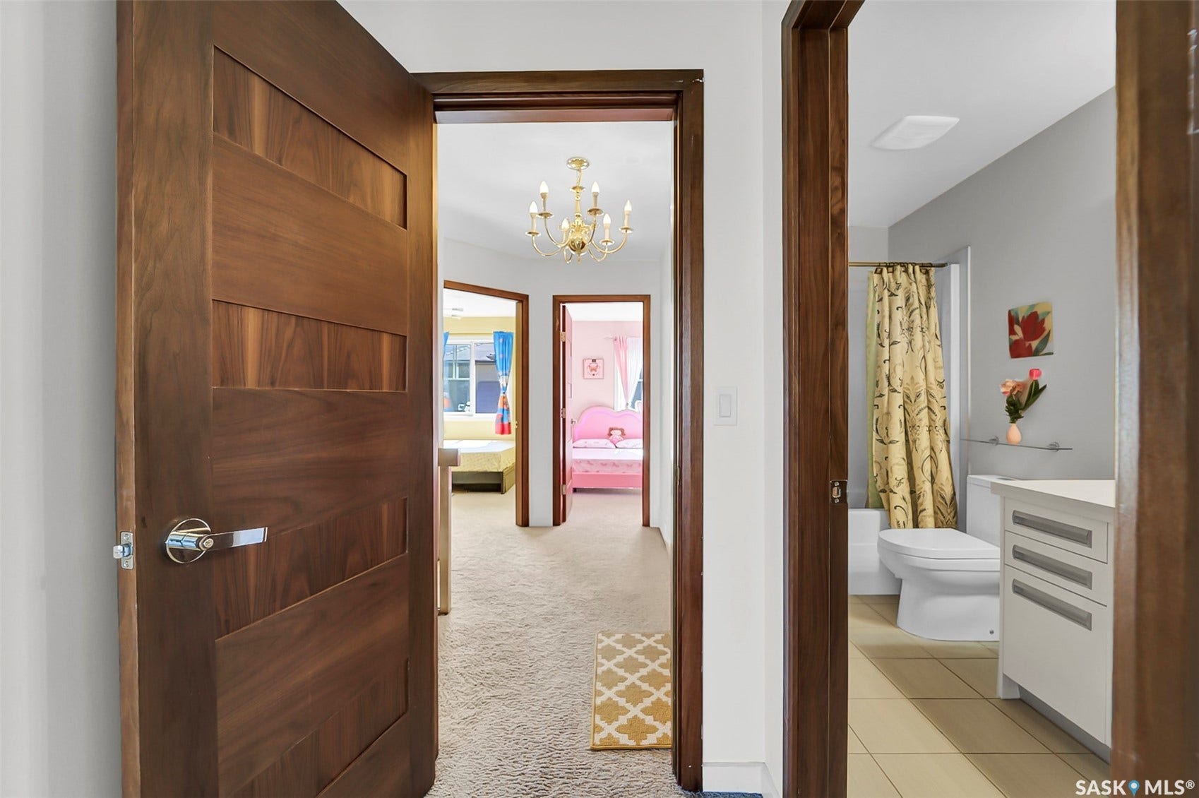 Modern wood-panel door with a polished chrome handle