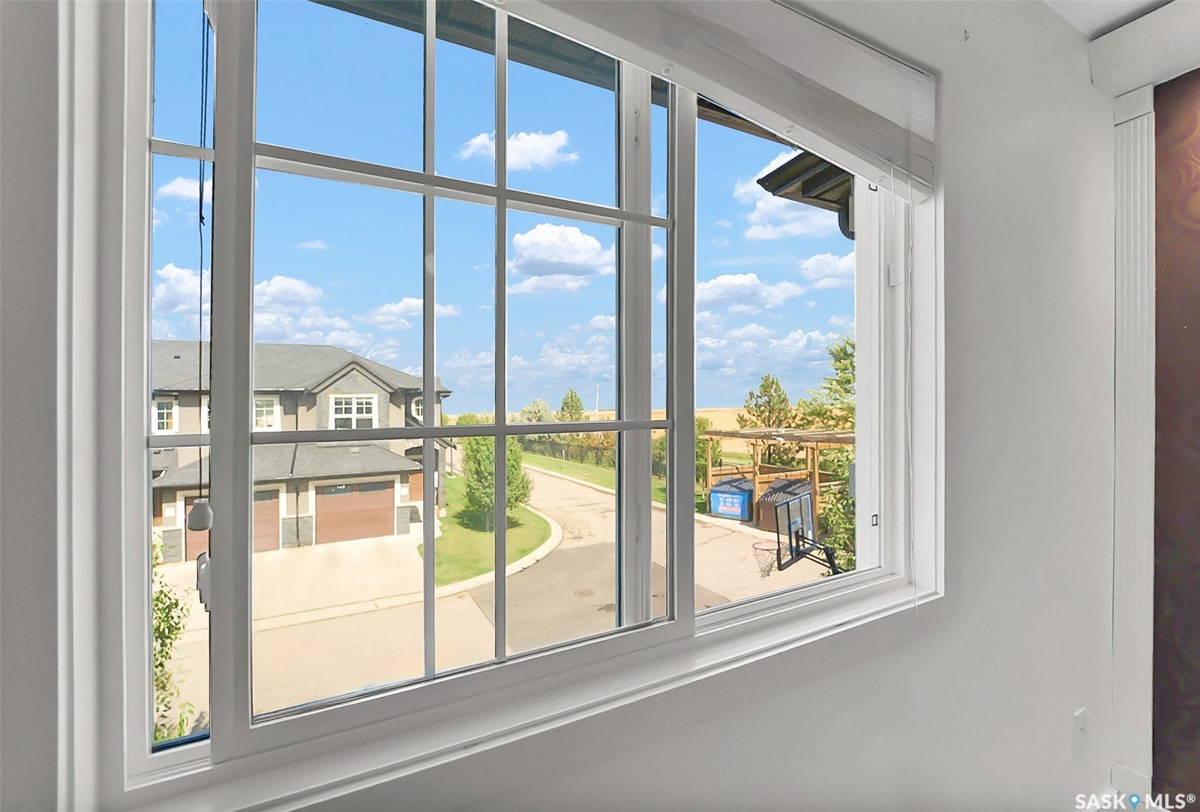 White window trim, gridded windowpanes, white wall finish