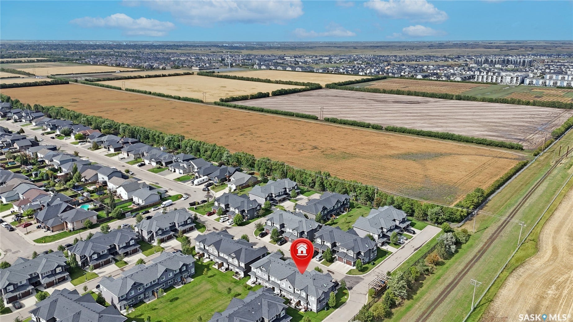 Aerial perspective of a developed residential area with uniform housing styles
