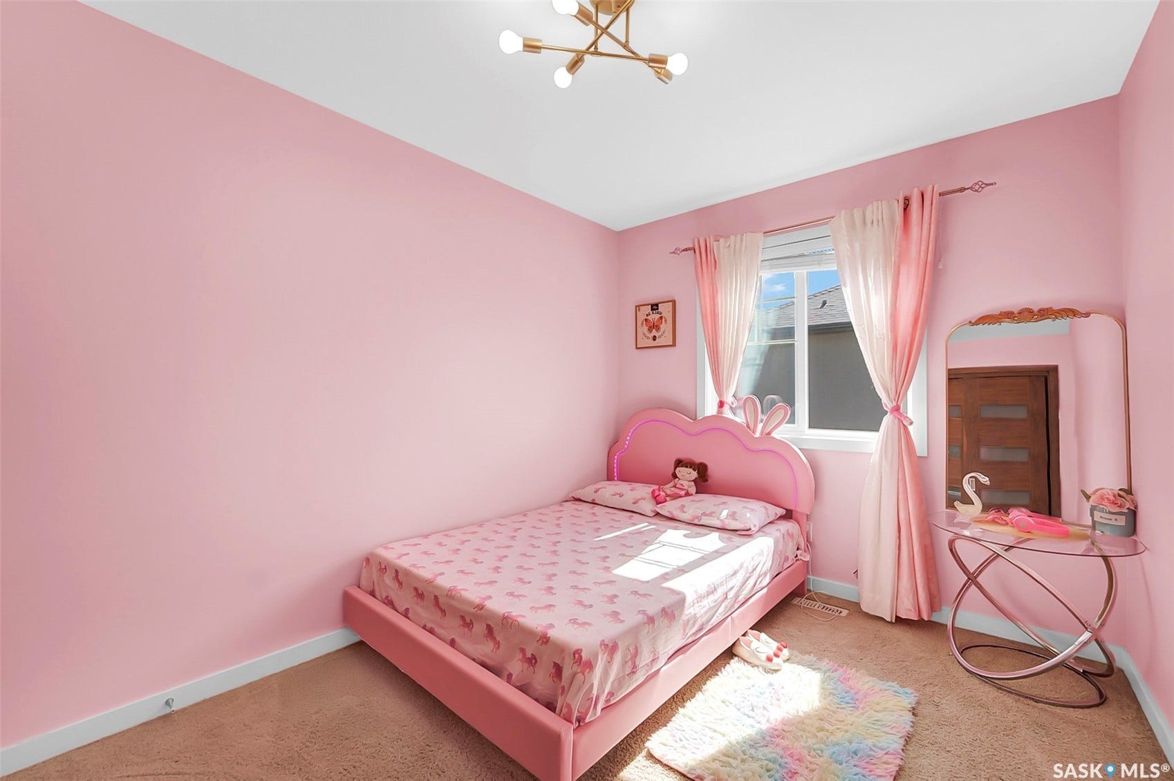 Recessed window with drapes, wall-mounted light fixture, and carpeted flooring