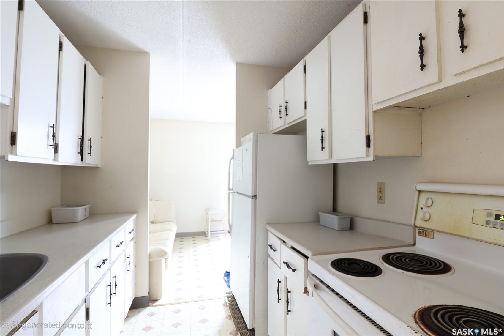 Kitchen featuring white cabinetry, white countertops, built-in refrigerator, built-in oven, and a stainless steel sink