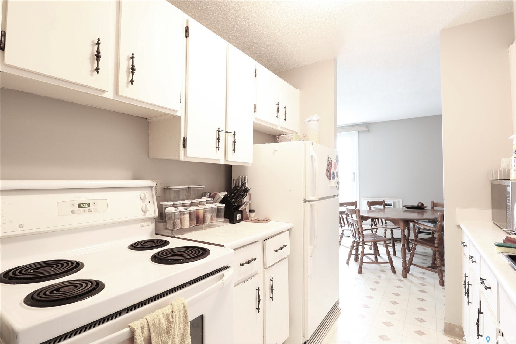 White cabinetry with dark hardware