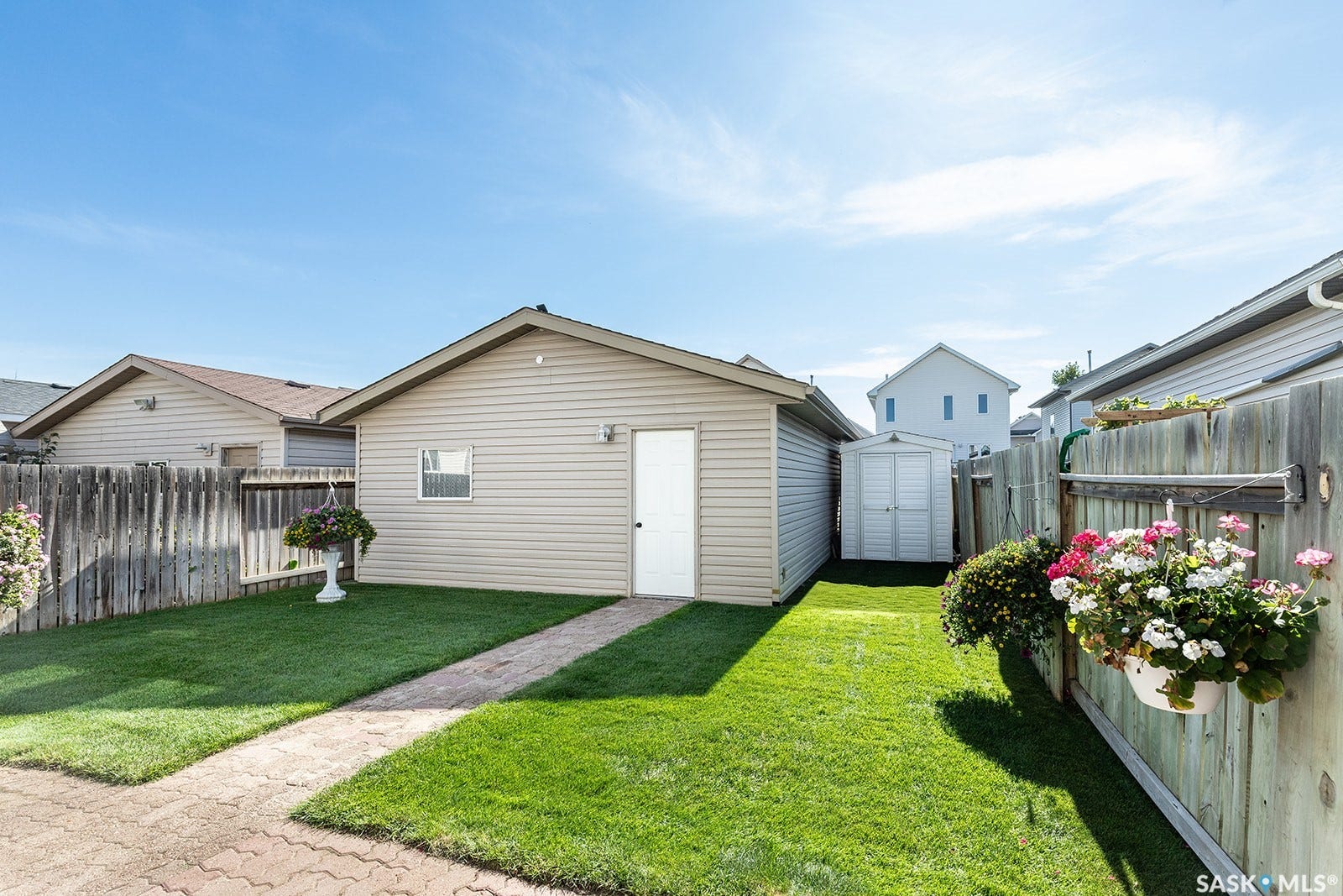 Paved walkway accessing the detached double garage
