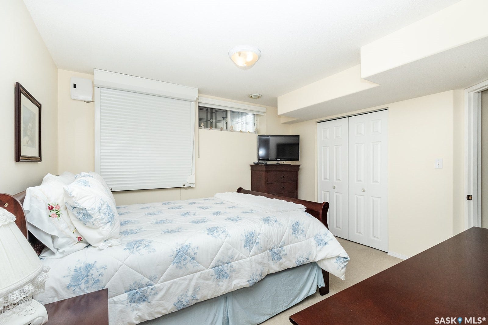 Basement bedroom with carpet flooring