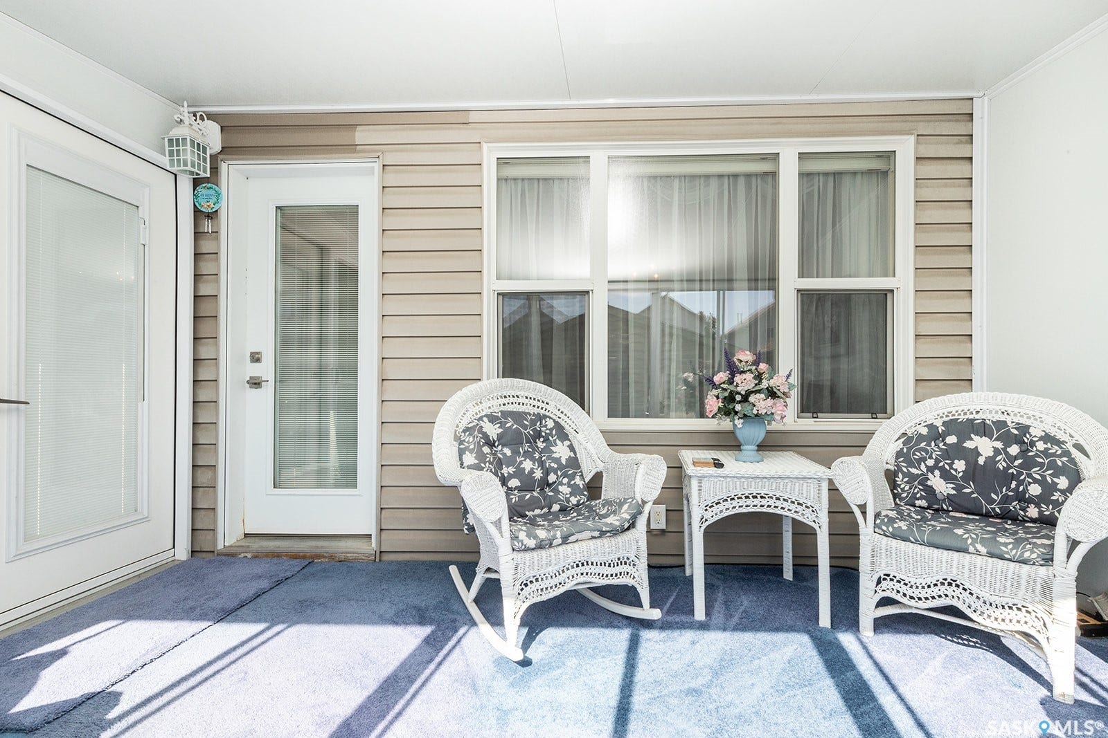 Enclosed sun room with multiple large windows