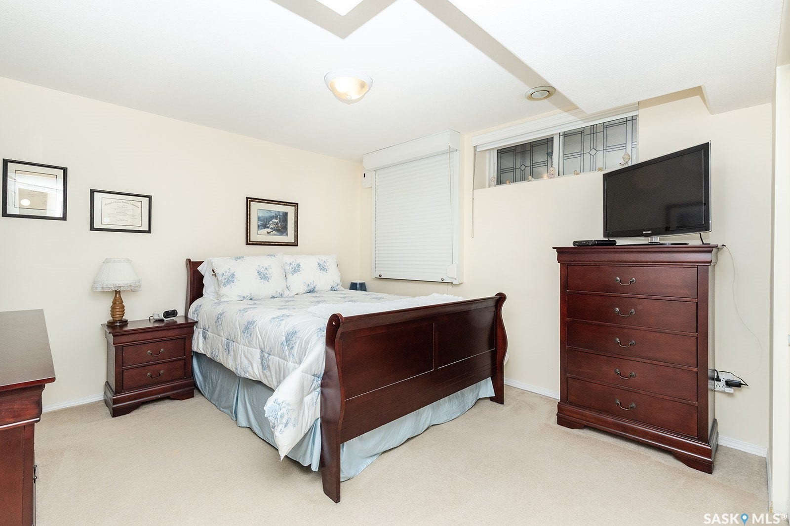 Basement bedroom with carpet flooring