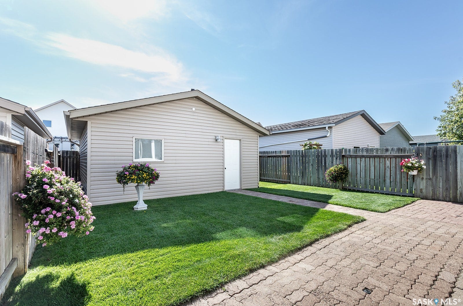Paved walkway accessing the detached double garage