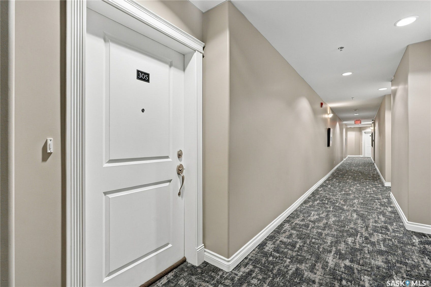 Entry door with decorative trim and brushed nickel hardware