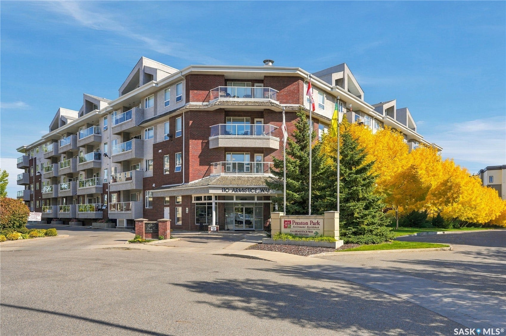 Multi-story building featuring brick and paneling exterior
