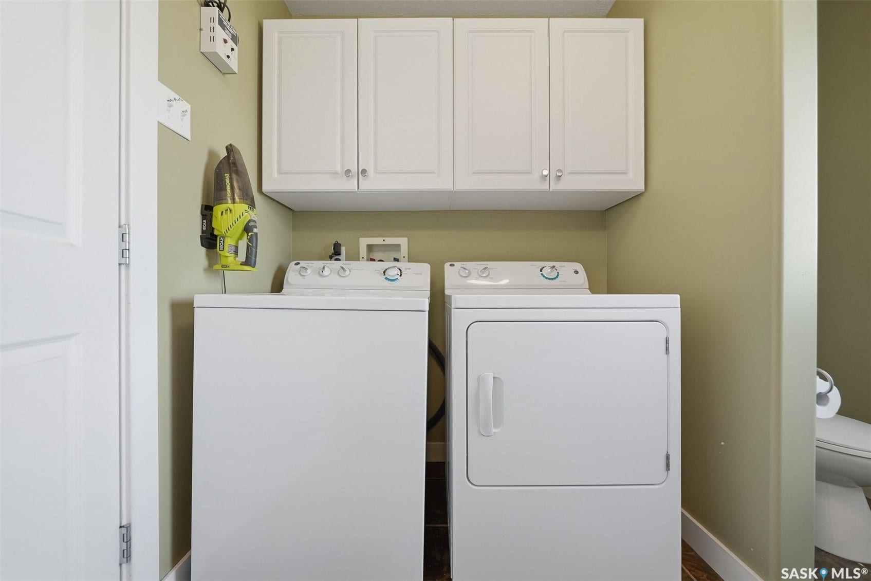 White upper cabinetry with brushed nickel hardware