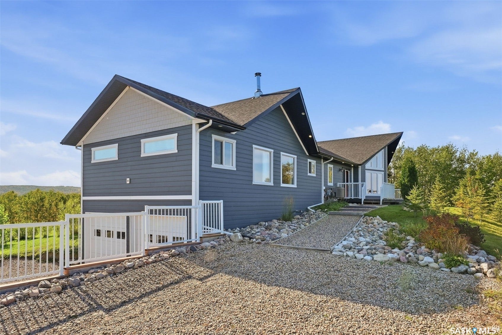 Modern exterior with dark gray siding and light gray shingle accents